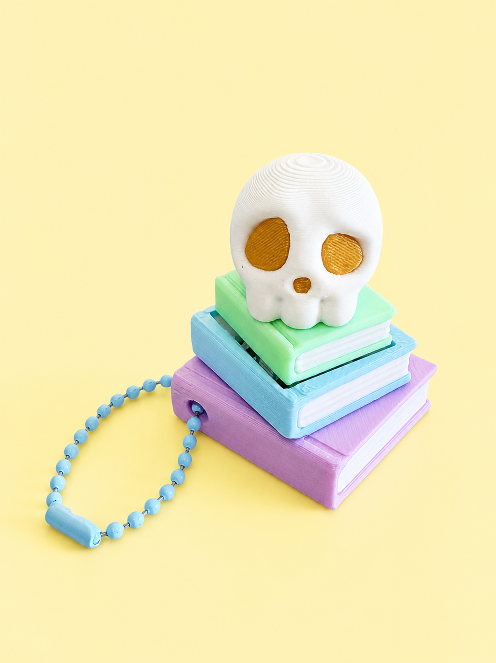 Skull and Book Stack Keyring Fidget Clicker